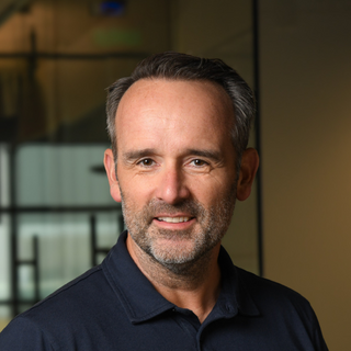 Portrait of Ryan Woodley CEO of Spectrum Equity