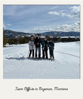 Team skiing in front of the lodge in Bozeman, Montana